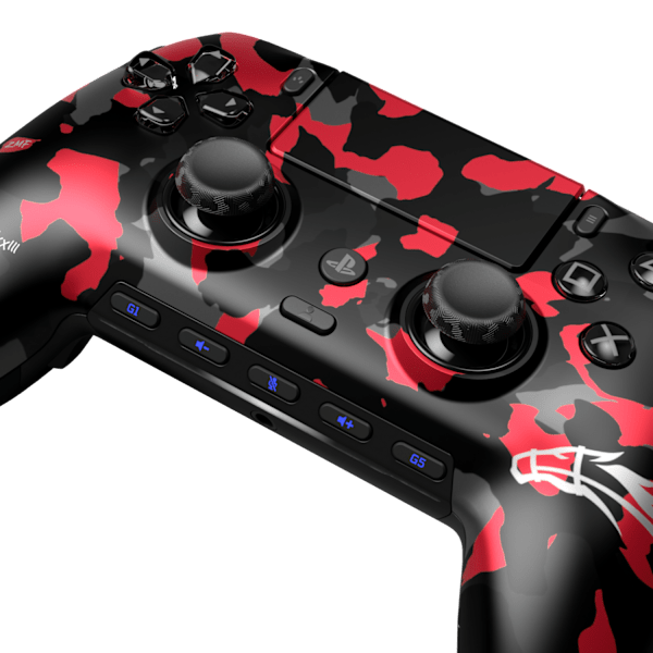 Close-up angled shot of the SCUF Omega Zoomaa PS5 controller’s red and black camo faceplate and thumbsticks.